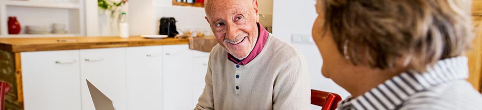 Photo of smiling senior man on computer -- BJC hospitals in Saint Charles County have doctors that specialize in Digestive Health